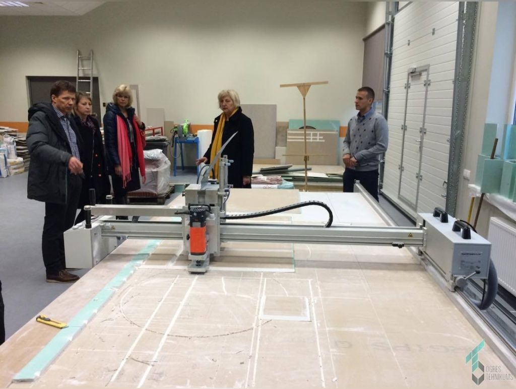 Association representatives viewing technical training equipment